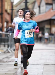 woman running in sarcoma UK top