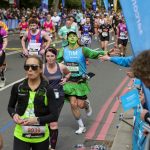 Photo of Sarcoma UK runner in all green costume with green face paint.