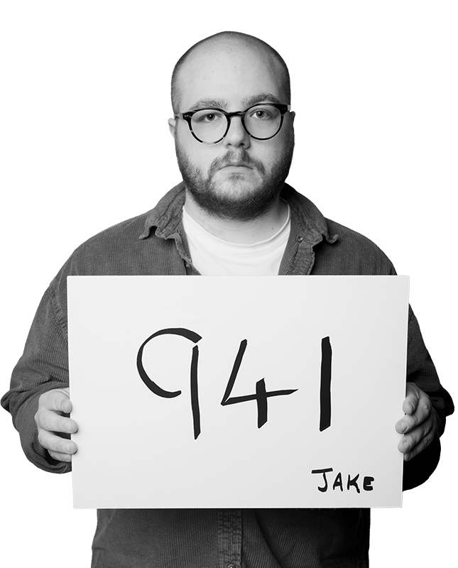 Photo of Jake holding a placard with '941' on it.