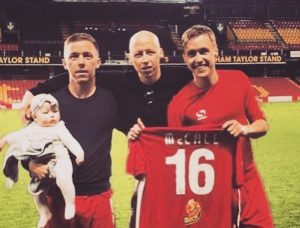 Spencer McCall, centre, with Darren, right, and his other brother Jack 