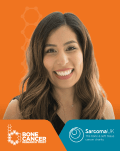 Professional portrait of Dr Meena Rafiq, a smiling woman with brown and blonde hair wearing black, against orange background. Features Bone Cancer Research Trust and Sarcoma UK charity branding at bottom of image.