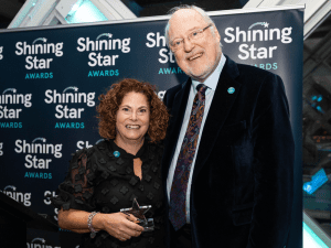 Karen Delin receives her Shining Star award from Sarcoma UK founder Roger Wilson