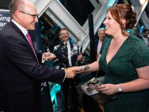 Lucy Whiddett receives her award from Sarcoma UK Trustee Gary Davison