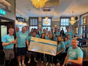M Core walkers with cheque for Sarcoma UK