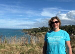 Woman standing by clifftop
