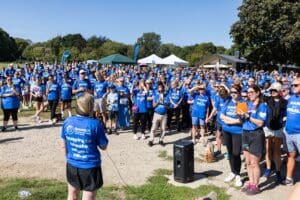 Adel Murphy addresses a crowd of walkers