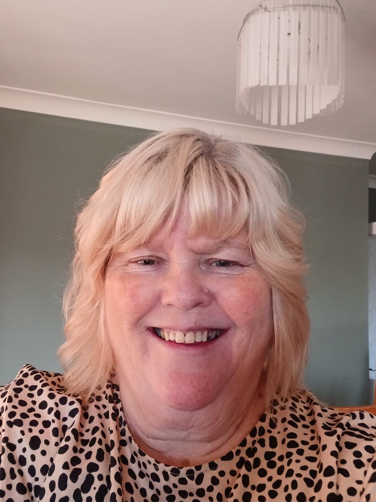 Photo of Jo Gronow, a smiling woman looking to camera.